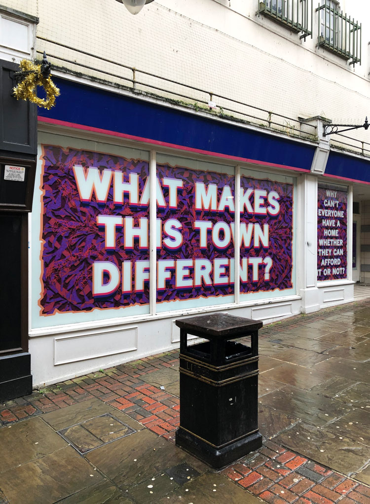 Mark Titchner. Some questions about Colchester?, 2020. Digital print on vinyl. Installed in disused shop units in Colchester.