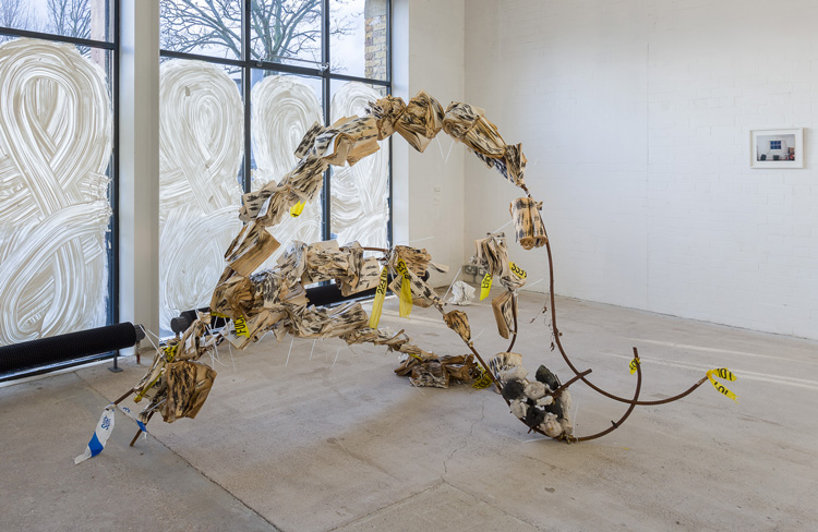 Michael Dean, (Unfucking Titled) fucked dove / pigeon, 2020. Steel, cable ties, padlocks, concrete, customised scene tape, paperback books (Pollen, 2015). Courtesy of the artist and Herald St, London. Photo: Mark Blower.
