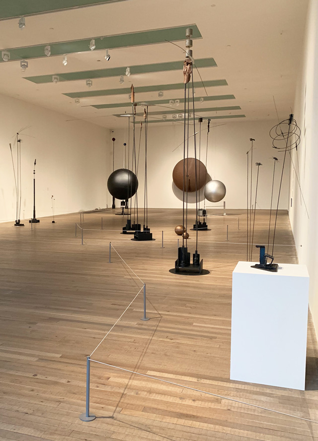 Takis. Installation view, with Musical Sphere, 1985 in the background. Tate Modern, 2019. Photo: Martin Kennedy.