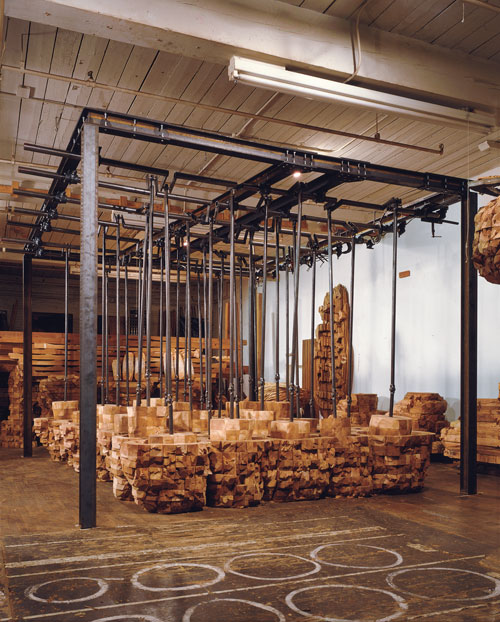 Studio view. Mama your legs, 2000. Cedar, graphite, steel and motor, 9ft. 5in. x 11ft. 8in. x 15ft. 6in.  Photo by David Allison. © Ursula von Rydingsvard. Courtesy Galerie Lelong, New York.