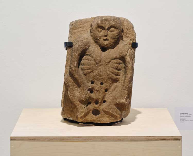 Sheela-na-gig, Sier Kieran in Co, Offaly, 13th-17th century, on loan from National Museum of Ireland. Installation view, IMMA, Dublin, 7 November 2025 – 5 July 2026. Photo: Ros Kavanagh.