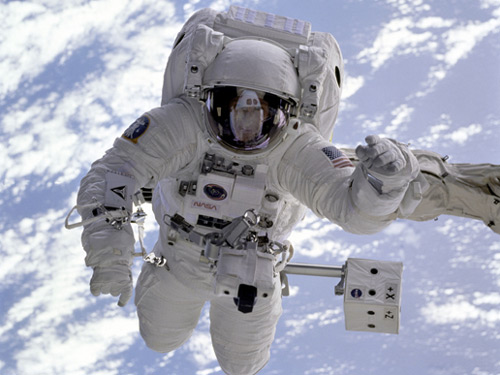 Astronauts repairing the Hubble Space Telescope. Endeavour space shuttle, 1993. The Hubble Space Telescope was sent into space in 1990. Orbiting outside the distorting effects of the Earth’s atmosphere, it has taken the most breath-taking images of our universe. This photograph shows astronauts F. Story Musgrave (on the robotic arm) and Jeffrey Hoffman (inside the shuttle) during the first servicing mission, which repaired a flaw in the telescope’s primary mirror. © NASA: http://www.nasa.gov/multimedia/imagegallery/image_feature_313.html