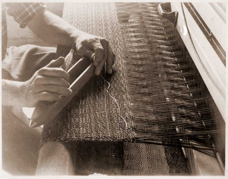 Alex Reed's hands and loom, n.d. Photograph by Claude Stoller, Western Regional Archives, State Archives of North Carolina.