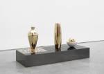 Claudia Wieser. Untitled, 2017. Gold leaf on wood, ceramic, and mirror-polished stainless steel on MDF,
7 1/8 x 48 1/2 x 18 1/8 in (18.1 x 123.2 x 46 cm) Plinth: 7 7/8 x 17 3/4 x 48 1/2 in (20 x 45 x 123 cm). Three sculptures, tallest: 18 in (45.7 cm). Courtesy of the artist and Marianne Boesky Gallery, New York and Aspen. © Claudia Wieser. Photograph: Object Studies.