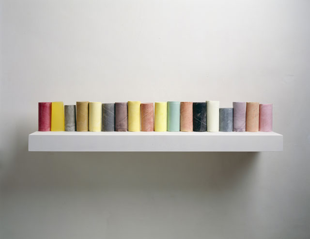 Rachel Whiteread. Line Up, 2007-8. Plaster, pigment, resin, wood and metal (18 units, one shelf), 28.5 x 40 x 25 cm. Private collection. © Rachel Whiteread. Photograph: Courtesy of the artist and Mike Bruce.