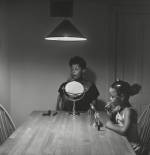 Carrie Mae Weems. Untitled (Woman and daughter with makeup) (from Kitchen Table Series), 1990. Gelatin silver print, 27 1/4 x 27 1/4 inches (69.2 x 69.2 cm). Collection of Eric and Liz Lefkofsky, Promised gift to The Art Institute of Chicago. © Carrie Mae Weems. Photograph: © The Art Institute of Chicago.
