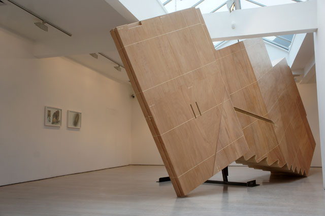 Richard Wilson. Space Between the Landing and the Gallery, 2017. Plywood on wood and metal, 310 x 740 x 101 cm. Photograph: Miayko Narita. © Richard Wilson. Courtesy Annely Juda Fine Art.