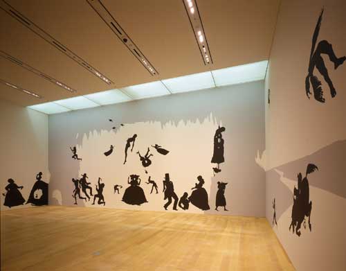 Kara Walker, <i>The Hot Black Road to Freedom, a double-dixie two-step 
        (Detail)</i>, 2005. Cut paper and adhesive on wall. Collection of the 
        artist and Brent Sikkema, New York. Installation view: The World is a 
        Stage: Stories Behind Pictures. Photo: Kioku Keizo. Photo courtesy: Mori 
        Art Museum