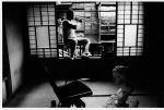 William Klein. Yoshimura practices trombone in Shinohara’s grandmother’s house, Tokyo, 1961. © William Klein.