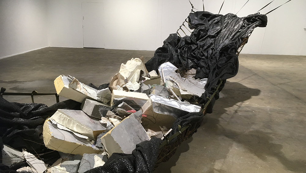 Yu Ji. Jaded Ribs, 2019-21. Rope, fishnet, fabric, breeze-block, plasterboard, metal, wax, cement. Photo: Veronica Simpson.