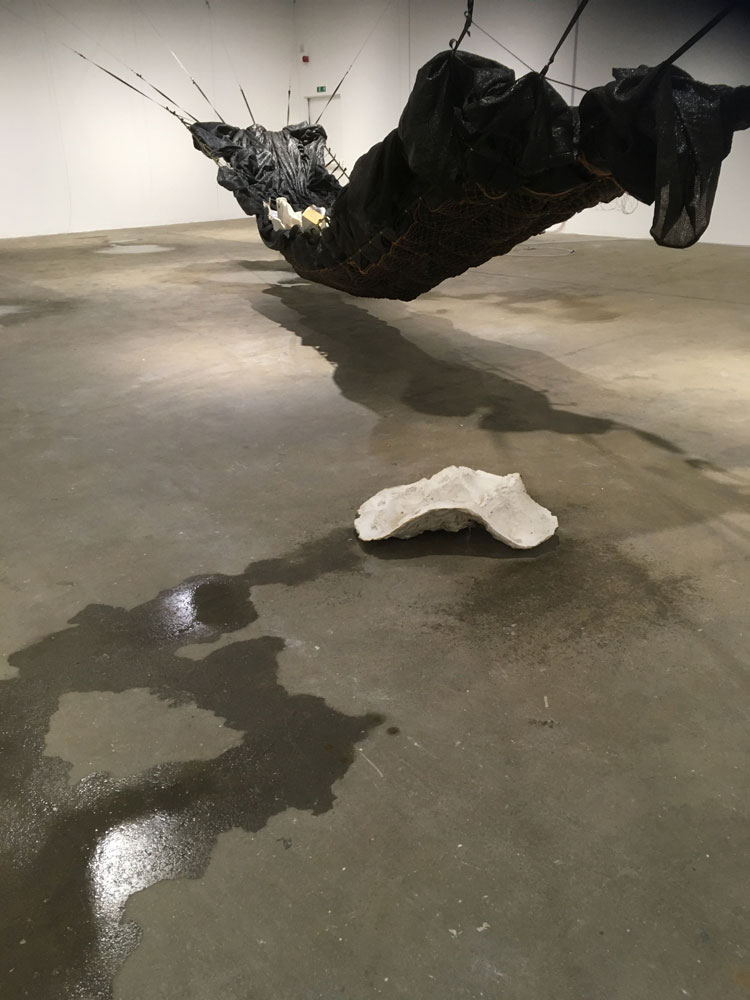 Yu Ji. Jaded Ribs, 2019-21. Rope, fishnet, fabric, breeze-block, plasterboard, metal, wax, cement. Photo: Veronica Simpson.