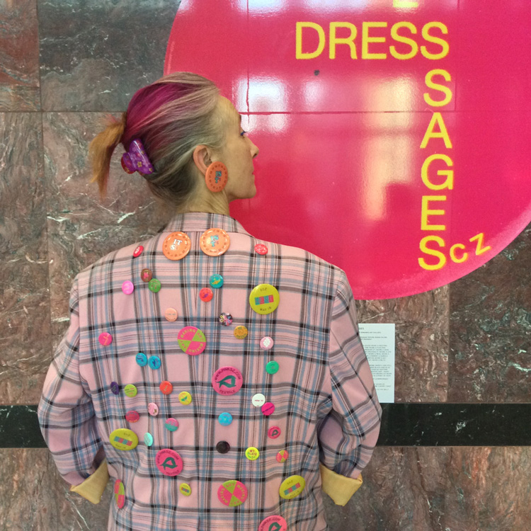 Silvia Ziranek in front of Dress Messages badge, Canary Wharf, 2019. Photo: Silke Dettmers.