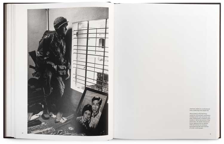 American soldier in an abandoned home sheltering from sniper fire. Many homes in Hué had been owned by civil servants, professors working at the local university and other intellectuals or political party members. Before the arrival of the Americans, the North Vietnamese forces captured Hué in January 1968 and carried out summary executions and the mass murder of 2,800–6,000 people. © Don McCullin.